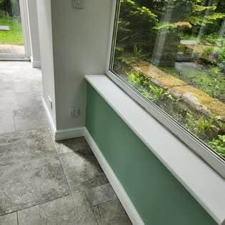 Conservatory redecoration — walls before repaint, post storm-damage roof repair